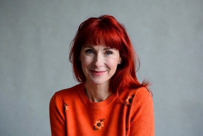 Woman with red hair smiling