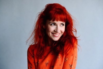 Smiling woman with red hair