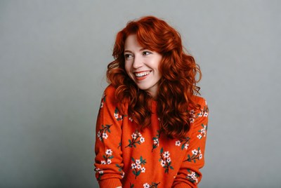 Smiling woman with red curly hair
