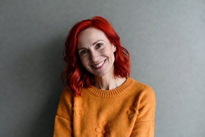 Smiling woman with red hair