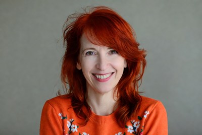 Smiling woman with red hair