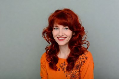 Smiling woman with red curly hair