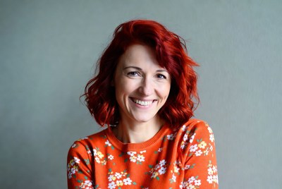 Smiling woman with red hair