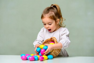 Girl holding colorful Easter eggs