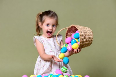 Girl holding overflowing Easter basket
