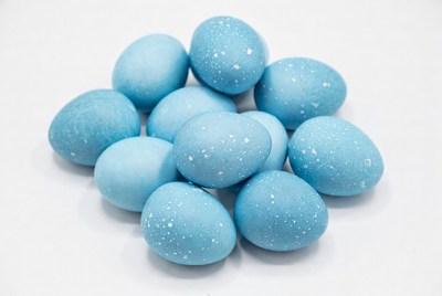 Blue speckled Easter eggs pile