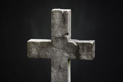 Stone Cross on Black Background