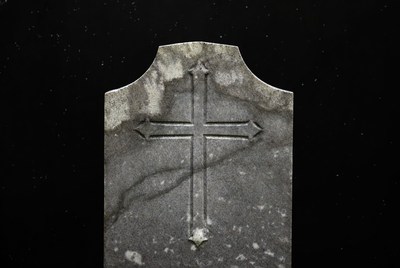 Old gravestone with cross
