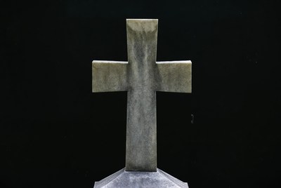 Stone Cross on Black Background