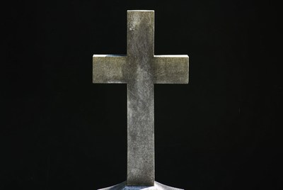 Stone Cross on Black Background