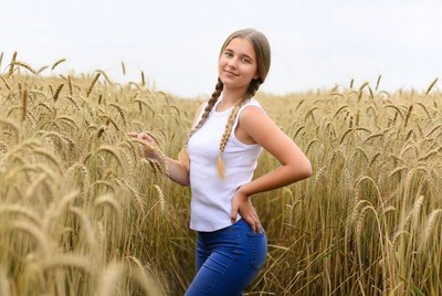 Girl with pigtails in wheat field