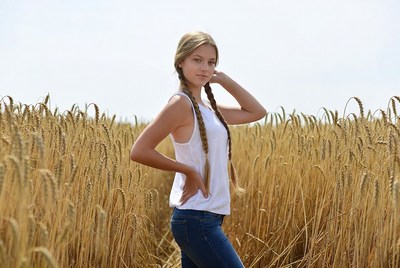 Blonde girl in wheat field