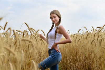 Woman with pigtails in wheat field