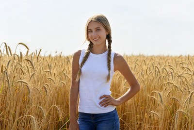 Girl with pigtails in wheat field