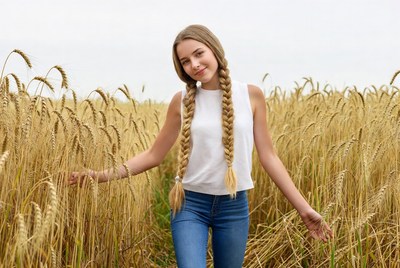Girl with braids in wheat field