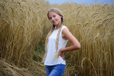 Blonde girl in wheat field