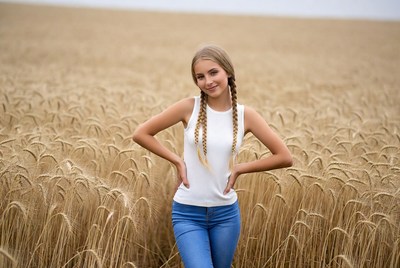 Girl with braids in wheat field