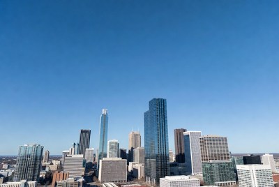 Modern city skyline under blue sky