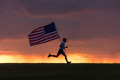 Man running with American flag silhouette