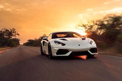 White Lamborghini Driving on Sunset Road