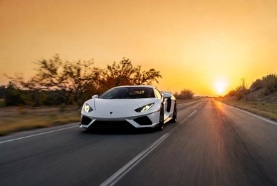 White Lamborghini Driving at Sunset