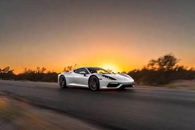 White Supercar Driving at Sunset