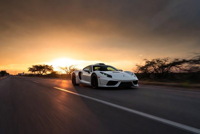 White McLaren Supercar Driving at Sunset