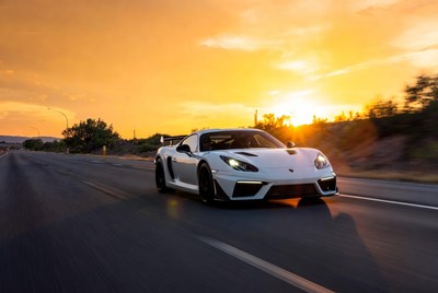 White Porsche 911 Driving at Sunset