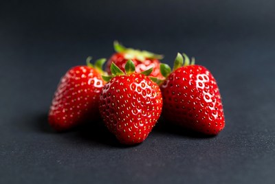 Fresh strawberries on black background
