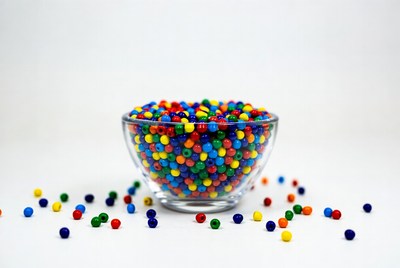 Colorful beads in glass bowl