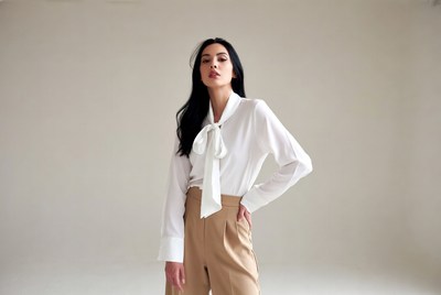 Asian woman in white bow blouse