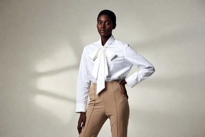 African-American woman in white bow blouse