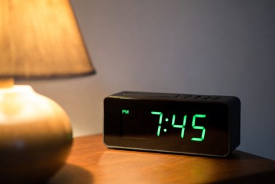 Digital alarm clock showing 7:45 PM
