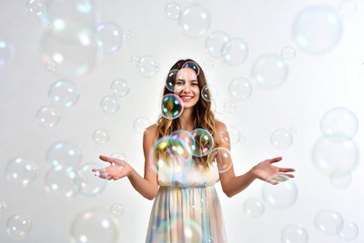 Woman surrounded by floating bubbles