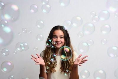 Girl smiling with soap bubbles
