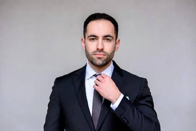Man adjusting tie in suit