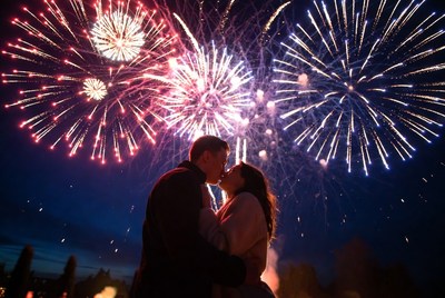 Couple kissing under fireworks