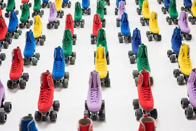 Colorful roller skates on white background