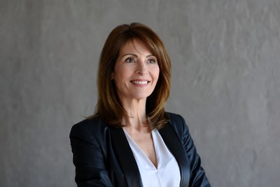 Smiling woman in black blazer