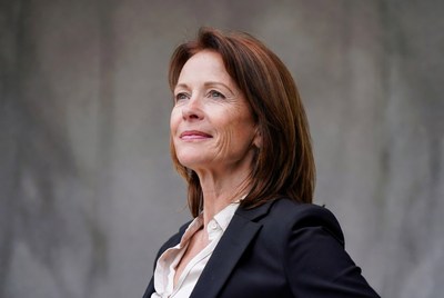 Smiling woman in black blazer