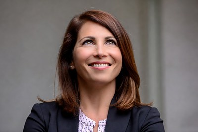 Smiling woman in black blazer