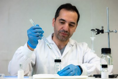 Man pipetting in lab