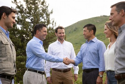 Business professionals shaking hands outdoors
