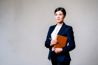 Business woman holding leather notebook