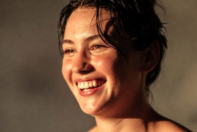 Smiling wet-haired woman closeup