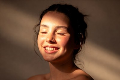 Smiling Woman in Sunlight