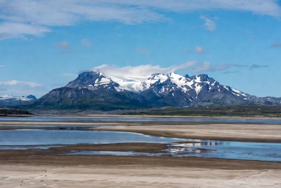Snowy Mountains over River Valley