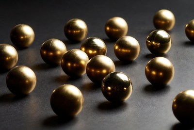 Golden metallic balls on black background
