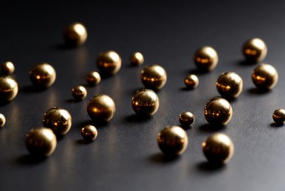 Golden metallic balls on black background