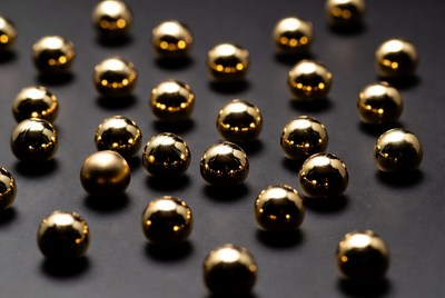 Shiny gold balls on black background